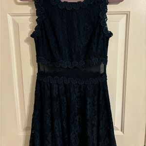 Knee length navy lace and sheer midsection cocktail dress